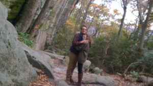 A couple enjoying their hike through the forest together. 